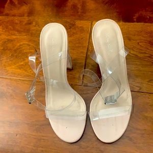 Tan colored shoes with clear straps